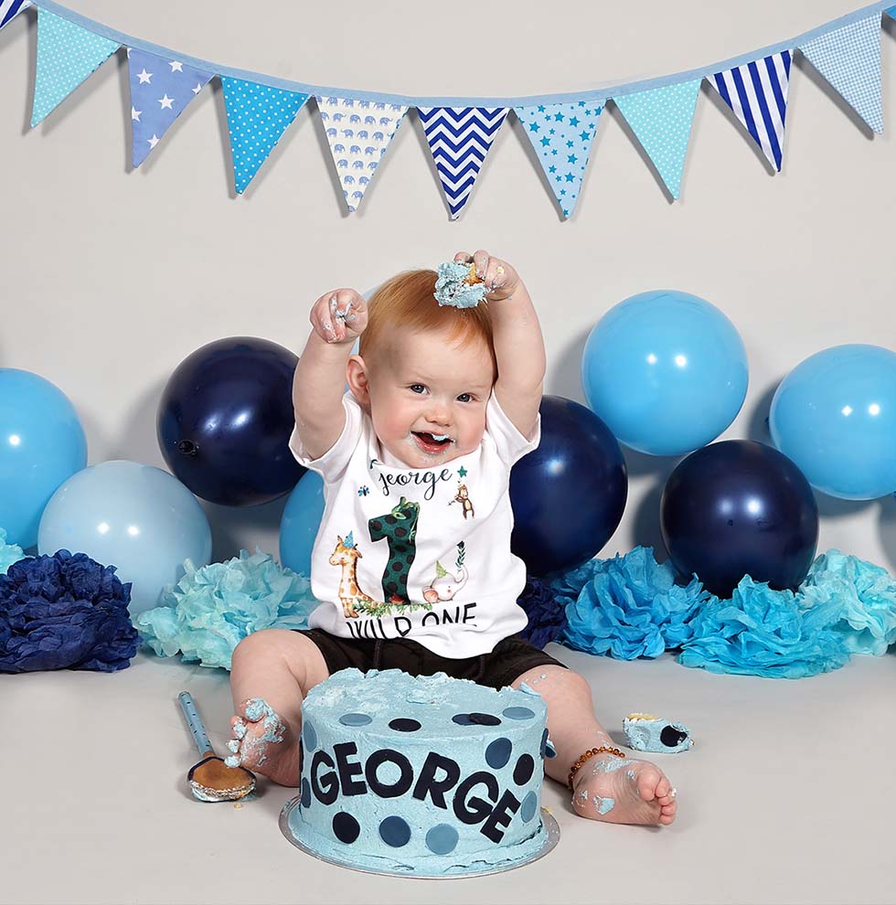 Baby Celebrates his FBirthday with Blue and Gold Cake Smash!